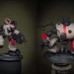 Dos figuras de acción de robots con armadura blanca y detalles en rojo vibrante, incluyendo **mechas pelirojas** en las rodillas y hombros.